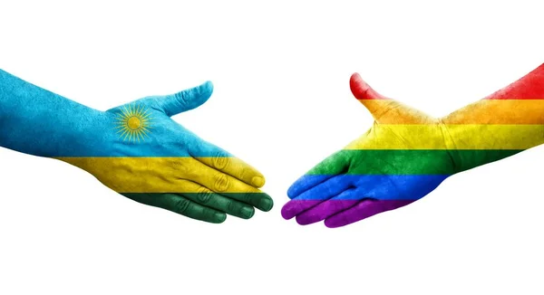 手に描かれたLgbtとルワンダの旗の間の握手 孤立した透明なイメージ — ストック写真