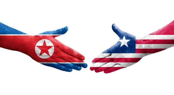 Aperto Mão Entre Libéria Coreia Norte Bandeiras Pintadas Mãos Imagem — Fotografia de Stock
