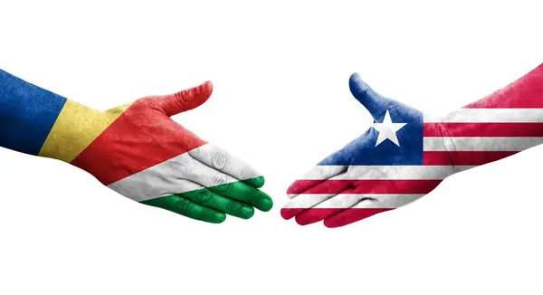 Händedruck Zwischen Flaggen Liberias Und Der Seychellen Auf Hände Gemalt — Stockfoto