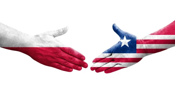 Händedruck Zwischen Liberianischen Und Polnischen Flaggen Auf Hände Gemalt Isoliertes — Stockfoto