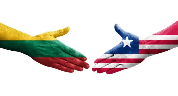 Händedruck Zwischen Liberianischen Und Litauischen Flaggen Auf Hände Gemalt Isoliertes — Stockfoto