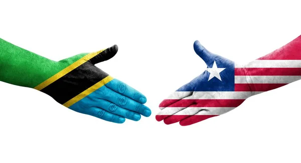 Händedruck Zwischen Flaggen Liberias Und Tansanias Auf Hände Gemalt Isoliertes — Stockfoto