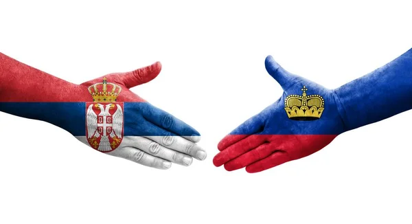 Apretón Manos Entre Las Banderas Liechtenstein Serbia Pintadas Las Manos —  Fotos de Stock