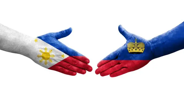 Handslag Mellan Liechtenstein Och Filippinerna Flaggor Målade Händer Isolerad Transparent — Stockfoto
