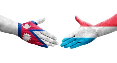 Lüksemburg ve Nepal bayrakları arasındaki el sıkışma ellerinde izole şeffaf görüntü.