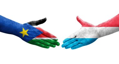 Lüksemburg ve Güney Sudan bayrakları arasında el sıkışma, izole şeffaf görüntü.
