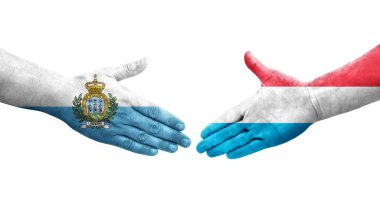 Lüksemburg ve San Marino bayrakları arasındaki el sıkışma..