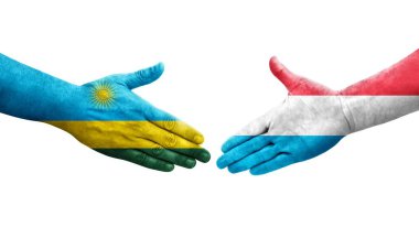 Lüksemburg ve Ruanda bayrakları arasında el sıkışma, izole şeffaf görüntü.