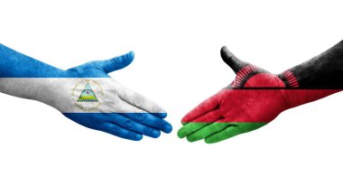 Ellerinde Malawi ve Nikaragua bayrakları arasında el sıkışma, izole şeffaf görüntü.