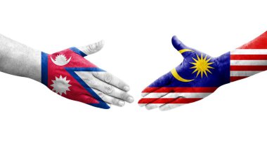 Ellere boyanmış Malezya ve Nepal bayrakları arasındaki el sıkışma, izole şeffaf görüntü.