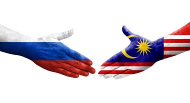 Malezya ile Rusya arasındaki el sıkışma ellerinde bayraklar, izole edilmiş şeffaf görüntü.
