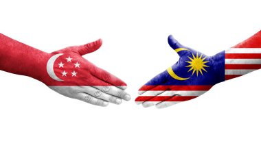 Malezya ve Singapur bayrakları arasındaki el sıkışma ellerinde resmedilmiş, izole şeffaf görüntü.