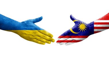 Ellere boyanmış Malezya ve Ukrayna bayrakları arasındaki el sıkışma, izole şeffaf görüntü.