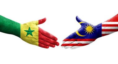 Malezya ile Senegal bayrakları arasındaki el sıkışma, izole şeffaf görüntü.