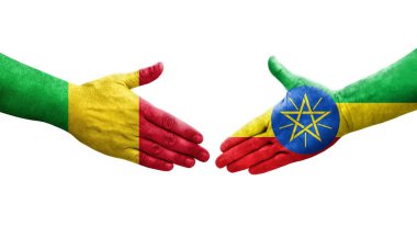 Mali ve Etiyopya bayrakları arasındaki tokalaşma elleri boyalı, izole şeffaf görüntü.