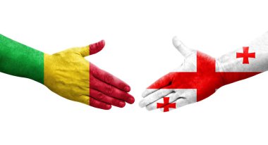 Mali ve Gürcistan bayrakları arasındaki el sıkışma ellerinde şeffaf bir görüntü..