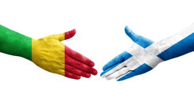 Mali ve İskoçya bayrakları arasındaki el sıkışma ellerde resmedilmiş, şeffaf görüntü.