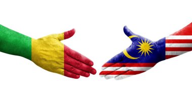 Mali ve Malezya bayrakları arasındaki el sıkışma ellerinde resmedilmiş şeffaf görüntü.