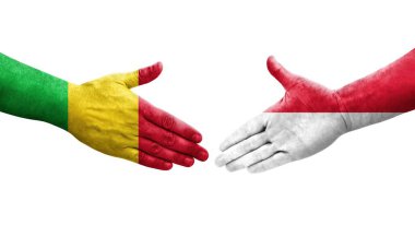 Mali ve Monako bayrakları arasındaki el sıkışma ellerinde resmedilmiş şeffaf görüntü.
