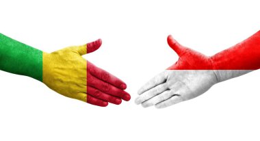 Mali ve Endonezya bayrakları arasındaki tokalaşma elleri boyalı, izole şeffaf görüntü.