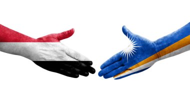 Marshall Adaları ve Yemen bayrakları arasındaki el sıkışma ellerinde izole şeffaf görüntü.