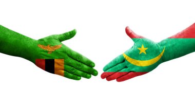 Moritanya ve Zambiya bayrakları arasındaki el sıkışma ellerinde resmedilmiş şeffaf görüntü.
