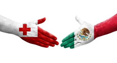 Meksika ve Tonga bayrakları arasındaki el sıkışma ellerinde resmedilmiş şeffaf bir görüntü..