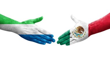 Meksika ve Sierra Leone bayrakları arasında el sıkışma..