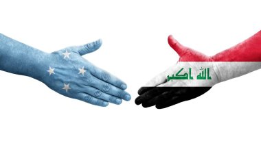 Mikronezya ve Irak bayrakları arasında el sıkışma, izole şeffaf görüntü.