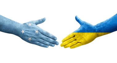 Mikronezya ve Ukrayna bayrakları arasında el sıkışma, izole şeffaf görüntü.
