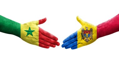 Ellerinde Moldova ve Senegal bayrakları arasında el sıkışma, izole saydam görüntü.