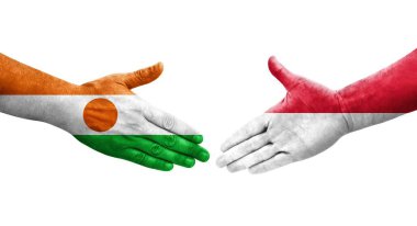 Ellerinde Monako ve Nijer bayrakları arasında el sıkışma, izole şeffaf görüntü.