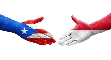 Monaco ve Porto Riko bayrakları arasındaki el sıkışma ellerinde izole şeffaf görüntü.