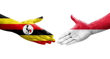 Ellerinde Monako ve Uganda bayrakları arasında el sıkışma, izole şeffaf görüntü.