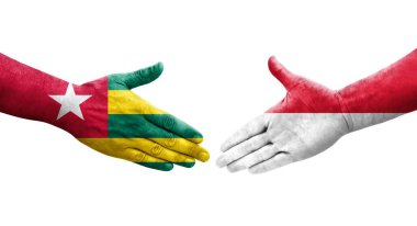 Ellerinde Monako ve Togo bayrakları arasında el sıkışma, izole şeffaf görüntü.