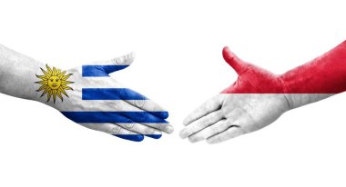 Monaco ve Uruguay bayrakları arasındaki el sıkışma, izole şeffaf görüntü.