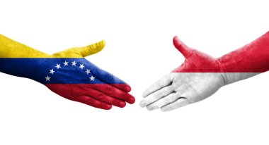 Monako ve Venezuela bayrakları arasındaki el sıkışma ellerinde resmedilmiş şeffaf görüntü.