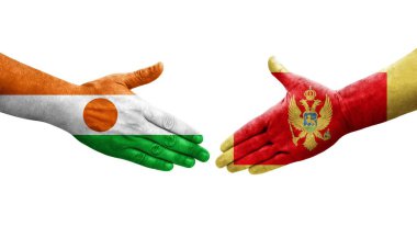 Karadağ ile Nijer bayrakları arasındaki el sıkışma el sıkışması, izole şeffaf bir görüntü.