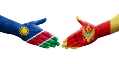 Karadağ ile Namibya bayrakları arasındaki el sıkışma, izole edilmiş şeffaf görüntü.