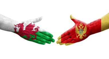 Karadağ ile Galler arasındaki el sıkışma, el yazısı ve izole edilmiş şeffaf görüntü.