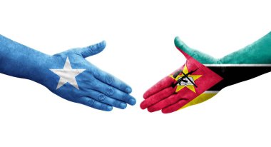 Ellerinde Mozambik ve Somali bayrakları arasında el sıkışma, izole şeffaf görüntü.