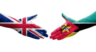 Mozambik ve Birleşik Krallık bayrakları arasındaki el sıkışma, izole şeffaf görüntü.