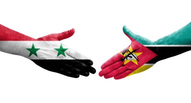 Ellerinde Mozambik ve Suriye bayrakları arasında el sıkışma, izole şeffaf görüntü.