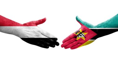 Ellerinde Mozambik ve Yemen bayrakları arasında el sıkışma, izole şeffaf görüntü.