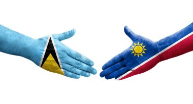 Namibya ve Saint Lucia bayrakları arasındaki el sıkışma..