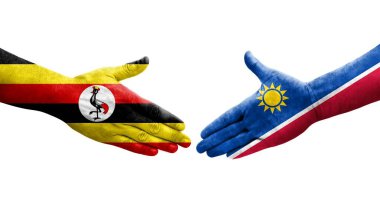 Ellerinde Namibya ve Uganda bayrakları arasında el sıkışma, izole şeffaf görüntü.