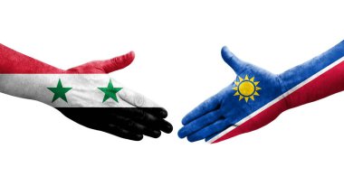 Ellere boyanmış Namibya ve Suriye bayrakları arasındaki el sıkışma, izole saydam görüntü.