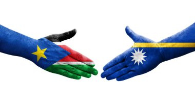 Ellerinde Nauru ve Güney Sudan bayrakları arasında el sıkışma, izole şeffaf görüntü.