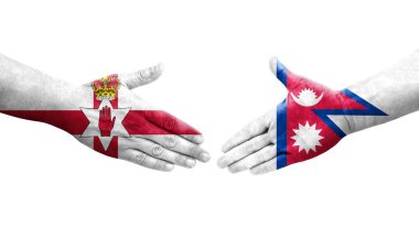 Nepal ve Kuzey İrlanda bayrakları arasındaki el sıkışma ellerinde resmedilmiş şeffaf görüntü.