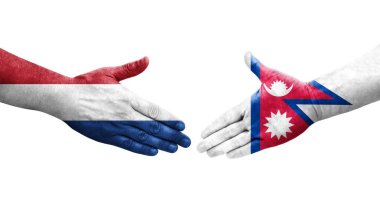 Ellere boyanmış Nepal ve Hollanda bayrakları arasındaki el sıkışma, izole şeffaf görüntü.